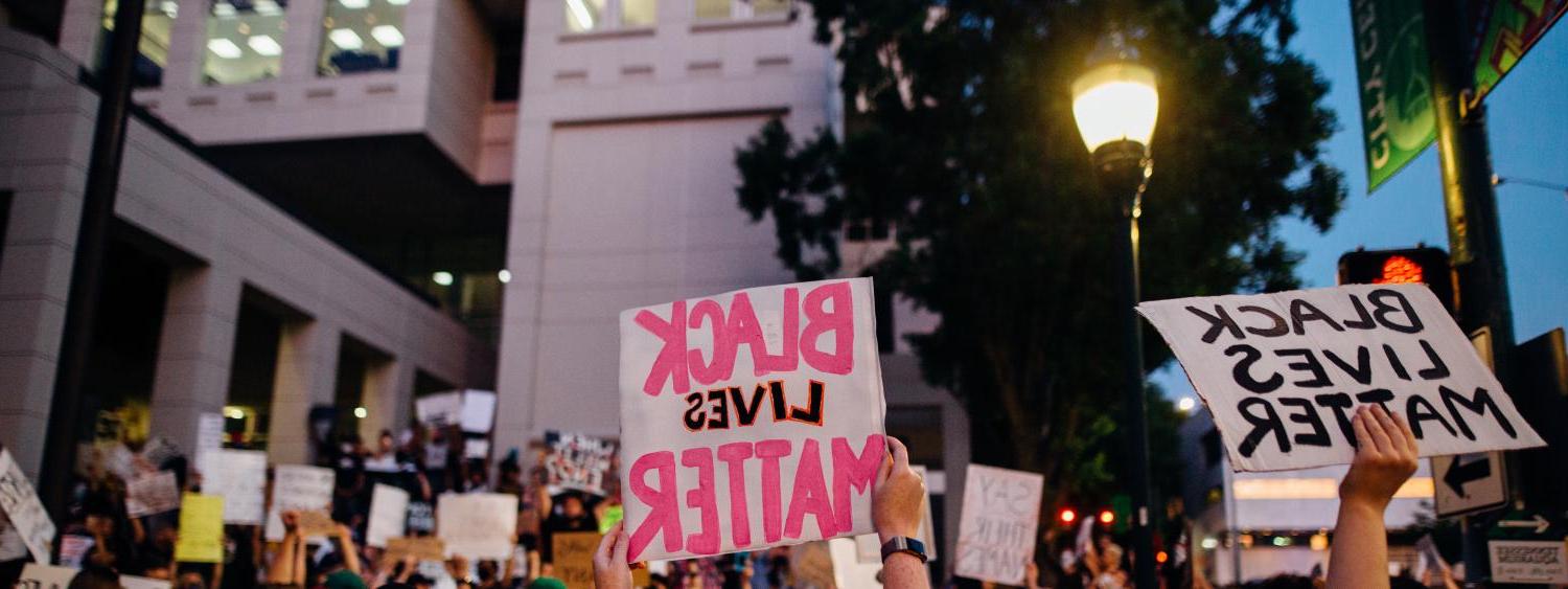 Protestors holding signs