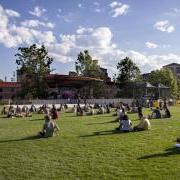 Students sit on Farrand Field lawn to watch a concert